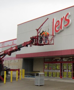 The Zellers sign comes off the store in the Burlington Mall. Store will get a total makeover and re-open as a Target store in April 2013